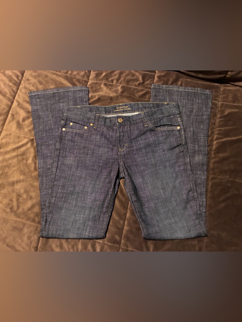Bebe brand, size 31, dark blue jeans, sparkly bebe and stars on backside